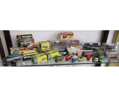 Shelf of diecast boxed cars, trains etc