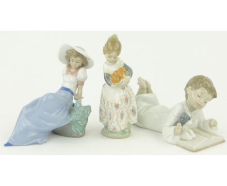 A Lladro figure, Orange Seller,
height 6" and 2 other NAO figures, (3).