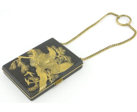A Japanese Komai gilded and enamelled evening purse on chain,
the cover decorated with an eagle, the interior fitted with com