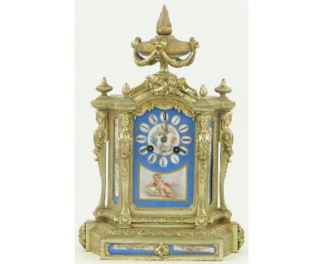 A French Louis XVI style ormolu mantel clock,
with inset Sevres style panels, with key and pendulum, height 14.75".