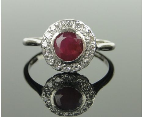 18ct white gold and platinum ruby and diamond cluster ring,
setting height 11mm, size N.