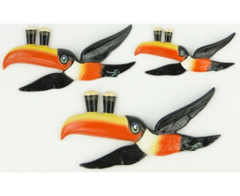 A set of 3 graduated Carltonware Guinness Toucan wall ornaments,
largest length 10".