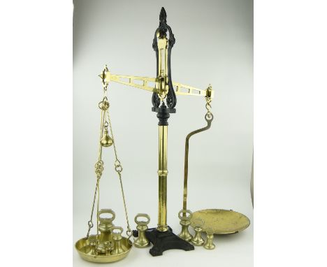 A Massive set of Victorian brass and iron shop scales,
by W & T Avery, height 50", together with a graduated set of 8 brass b