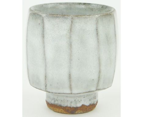 A Jim Malone Studio Pottery stoneware tea bowl,
faceted circular form, ash glaze, Ainstable seal mark, height 4.25".