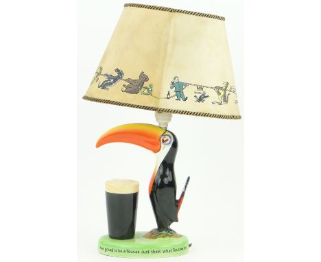 A Carltonware Guinness Toucan design table lamp,
with original shade, height incl. shade 16.5".