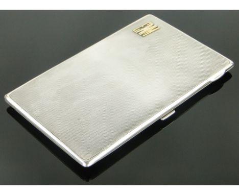 A good quality Art Deco silver cigarette case,
with gold mounts, makers marks C S G & Co., 7.5oz, length 16cm.