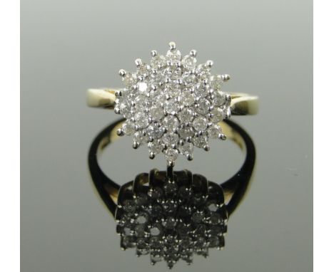 A 9ct gold diamond cluster ring,
approx. 0.5cts total, size K.