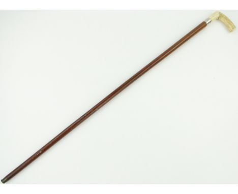 A Victorian Malacca sword stick,
with bone handle and blue steel blade.