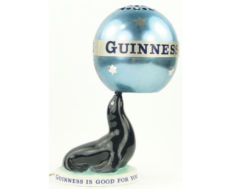 A Carltonware Guinness seal design table lamp,
with original revolving metal shade, height incl. shade 14".