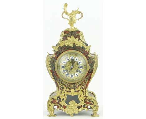 A 19th century Louis XVth style French boulle work mantel clock,
with ormolu mount and sunburst pendulum, and key, height 16.