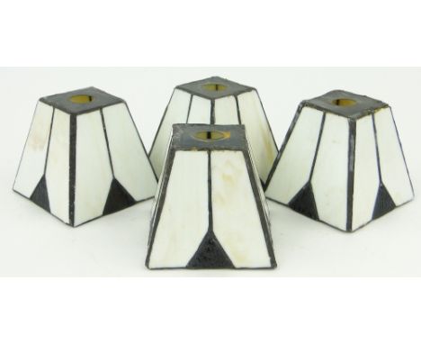 A set of 4 Art Deco black and white glass lamp shades,
height 3.75".