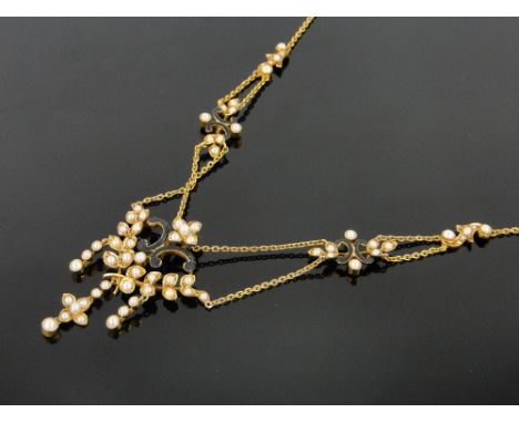 An Edwardian 15ct gold pearl and enamel necklace, boxed.