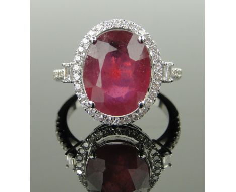 14ct white gold ruby and diamond cluster ring,
ruby approx. 6.8cts, diamond content approx. 0.5cts, setting height 15mm, size