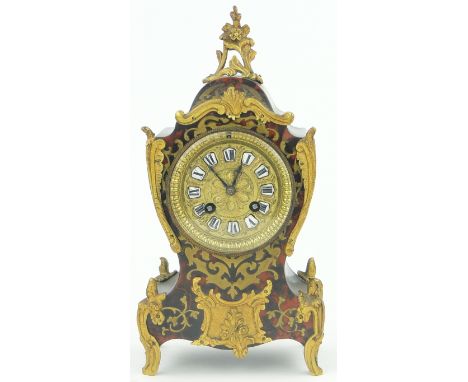 A 19th century boulle marquetry balloon cased mantel clock,
2-train movement, ormolu mounts, back of dial marked J.J.S., 4017