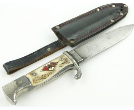 A Second World War Nazi dagger 
by Solingen, overall length 9.3", blade length 5.25", in leather scabbard.