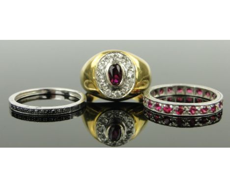 3 various stone set rings,
including a white gold black diamond ring, a 9ct white gold ruby eternity ring, etc., (3).