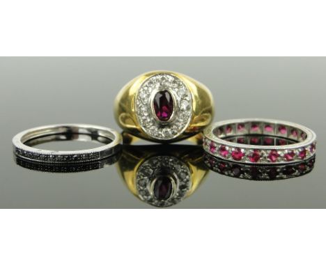 3 various stone set rings,
including a white gold black diamond ring, a 9ct white gold ruby eternity ring, etc., (3).