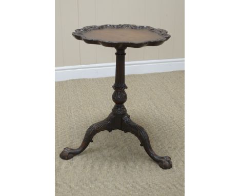 A Chippendale design Wine Table with well carved pie crust top on turned and fluted column, carved tripod base with ball and 