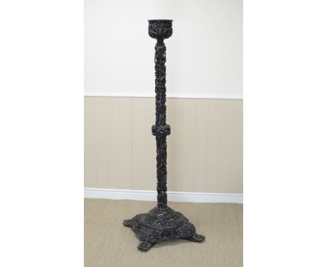 A Chinese carved Lantern Stand, late 19th Century, profusely carved in high relief and pierced through with squirrels amongst