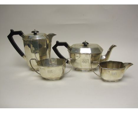 A George VI silver four piece Tea Service of panelled form engraved initial W, Sheffield 1942, maker: S & W
