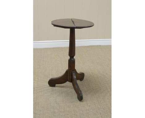 A small antique mixed wood Candle Stand with circular top on turned and hexagonal column, scroll tripod base, 14in diam