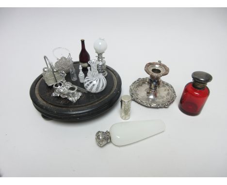 A Victorian silver lidded ruby glass Scent Bottle, London 1859, a cylindrical Scent Bottle, Birmingham 1885, an opaline glass