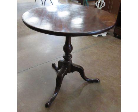 A George III mahogany Pillar Table, the circular top above a turned baluster column on carved tripod legs, 2ft 2 1/2 in W