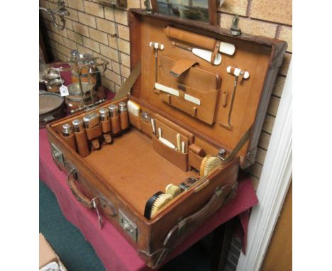 A Gentleman's leather Travelling Case with dressing item fittings to interior, stamped J.T. Needs, 100 New Bond Street, 2ft 3
