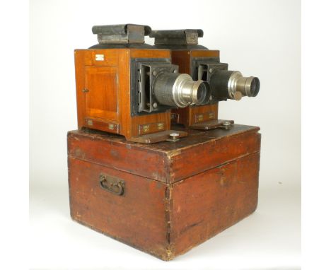 A 19th Century J H Steward twin Magic Lantern Set, matching mahogany bodied magic lanterns with metal fittings and black fini
