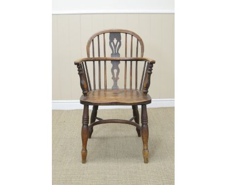 A 19th Century Windsor Armchair with pierced splat and stick back, solid seat on turned legs united by crinoline stretcher