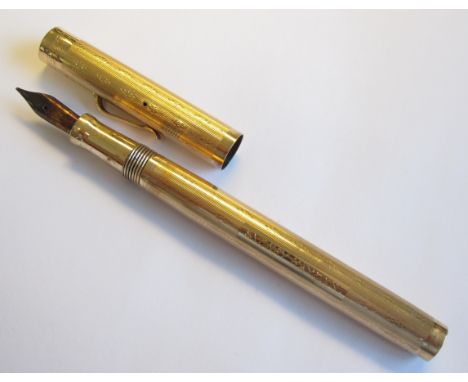 A Wahl-Eversharp Fountain Pen with engine turned case stamped 14K, engraved SYDNEY HAYDEN