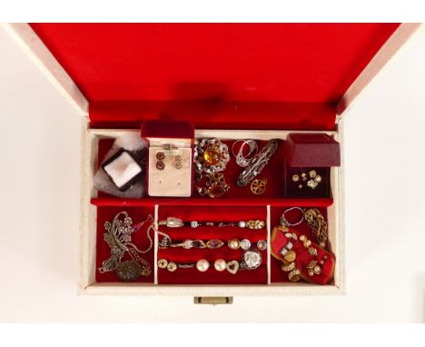 A collection of vintage costume jewellery containing earrings, pendants, chains, Silver etc in a leather jewellery box.