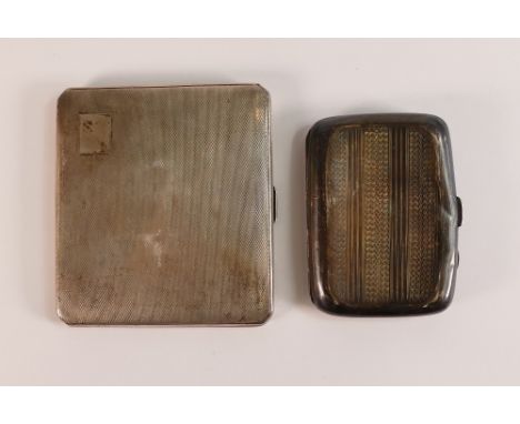 Silver cigarette case hallmarked for Birmingham 1940 and another silver smaller case,172.5g. (2)