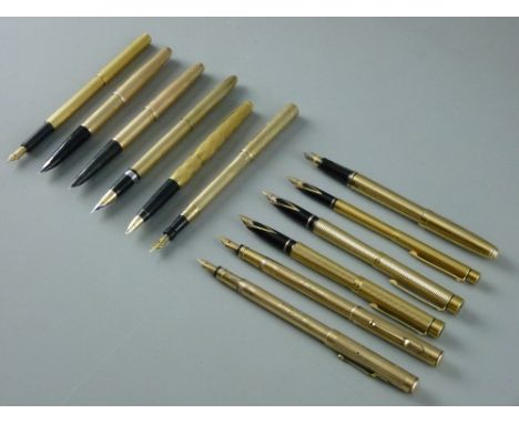 TWELVE GOLD & GOLD COLOURED VINTAGE FOUNTAIN PENS, including a Mabie Todd & Co Swan nine carat gold leverless twist filler, t