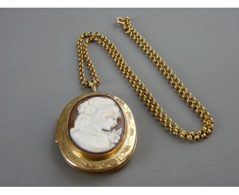 A NINE CARAT GOLD BRIGHT CUT OVAL PHOTO LOCKET with lady cameo cover and muff type link chain, 38 grms gross