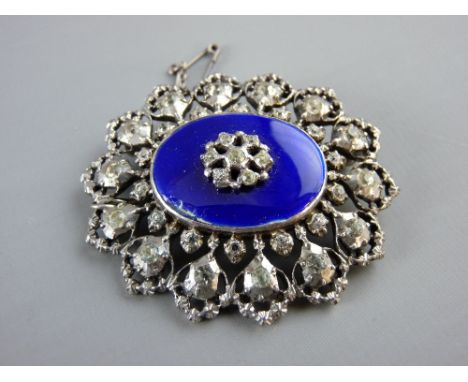 AN OVAL SILVER BROOCH, London 1954 with a central oval blue enamel tablet with centre cz decoration and surrounding czs in tw