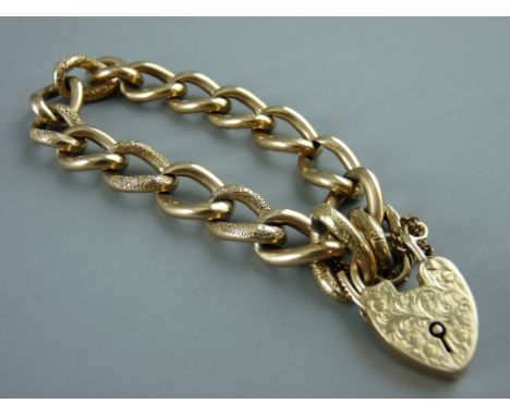 A NINE CARAT GOLD LINK BRACELET with bright cut padlock and safety chain, 25 grms
