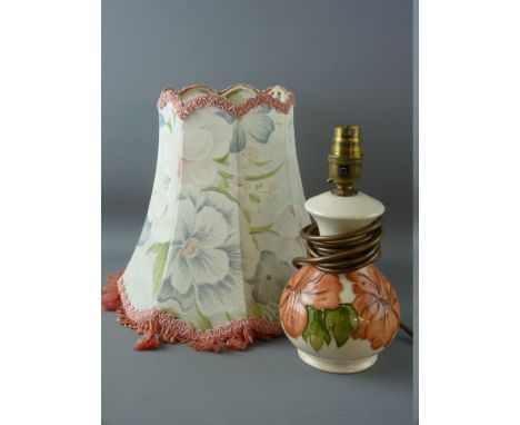 A MOORCROFT 'CORAL HIBISCUS' TABLE LAMP decorated on an ivory ground with cloth covered floral lampshade attached, impressed 