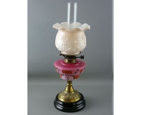 A VICTORIAN OIL LAMP, brass column with milk glass shade and milk glass floral decorated reservoir