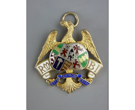 A NINE CARAT GOLD & COLOURED ENAMEL EAGLE PENDANT by G Kenning & Son, 18 grms gross, dated for Birmingham 1934 and the coat o