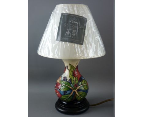 A MOORCROFT 'SIMEON' TABLE LAMP & SHADE, designed by Phillip Gibson, 35 cms high overall