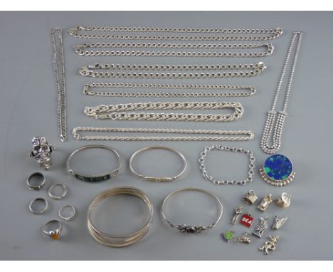 A QUANTITY OF SILVER JEWELLERY, hallmarked or stamped 925, to include six rings, four bangle bracelets, a stone inset brooch,