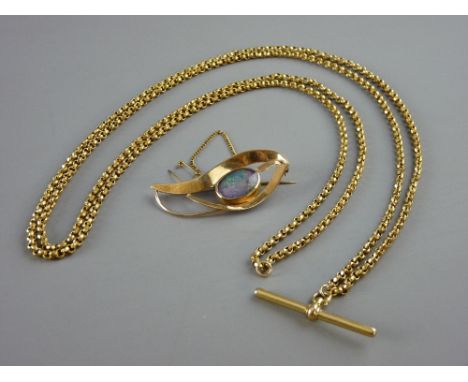 A NINE CARAT GOLD MODERN ABSTRACT STYLE BROOCH with large oval opal and safety chain, 7 grms and a yellow metal muff chain wi