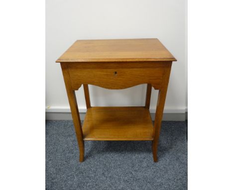 A NEAT LIGHT OAK OBLONG TOPPED CUTLERY CANTEEN having a shaped front apron and base shelf