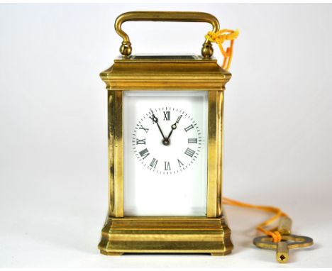 A miniature brass carriage clock, H. 9cm.