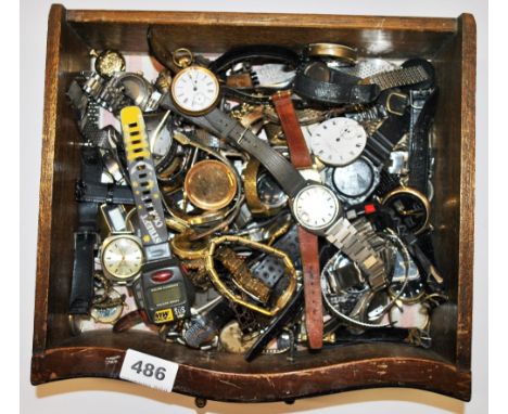 A box of vintage watches and parts.