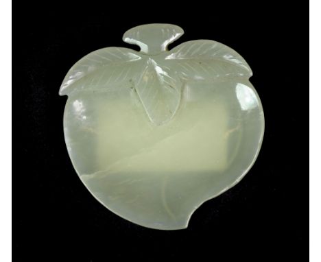 A lovely Chinese peach shaped jade brush washing bowl, c.1900. W. 5.5cm.