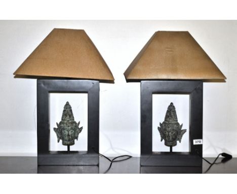 A pair of contemporary bronze Deity head table lamps, H. 56cm.