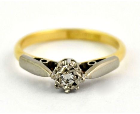 An 18ct yellow gold and platinum diamond solitaire ring (K).