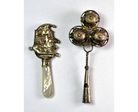 A Chester hallmarked silver and mother of pearl Mr Punch baby's rattle and a further white metal baby's rattle stamped 97.